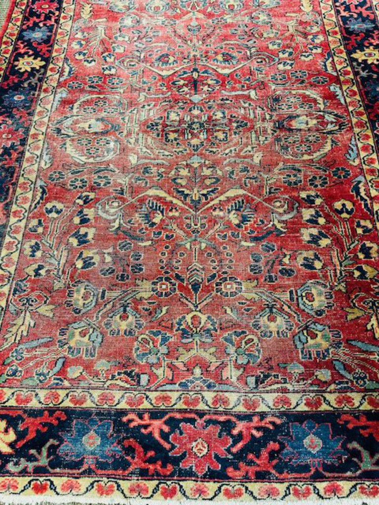 Persian Heriz Wool Rug - Red, with blue and ocher accents.