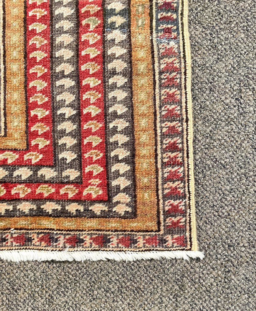 Antique Ghioirdes Handwoven Red Rug with Gold and Black Accents