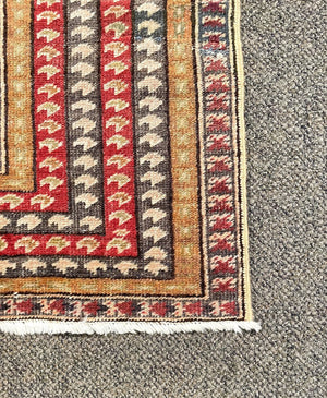 Antique Ghioirdes Handwoven Red Rug with Gold and Black Accents