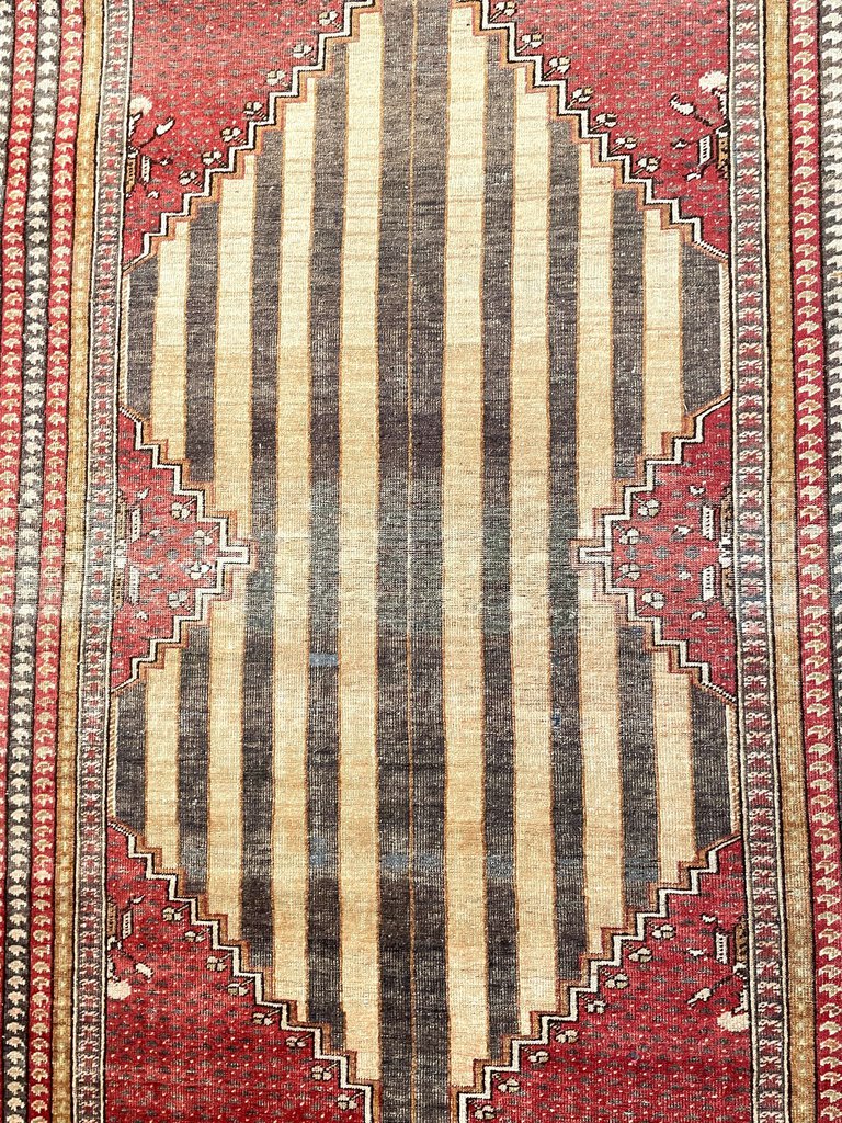 Antique Ghioirdes Handwoven Red Rug with Gold and Black Accents