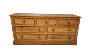 Pine 7 Drawer Dresser With Natural Finish On Casters