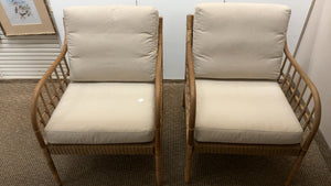 Pair of rattan arm chairs with cushions