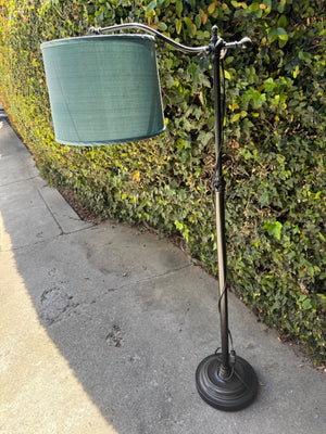 Black gooseneck floor lamp with blue shade