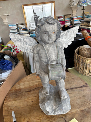 Carved cherub figurine