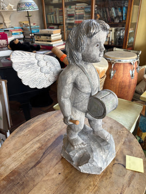 Carved cherub figurine