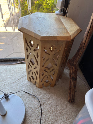 Carved wooden side table