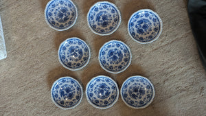 Set of 8 porcelain saucers