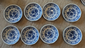 Set of 8 porcelain tea saucers