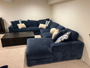 U-shaped blue couch