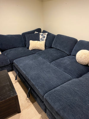 U-shaped blue couch
