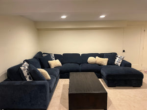 U-shaped blue couch