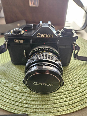 Canon EF 35mm SLR Camera Body Only with Built-In Lens Mount (5.7 in W x 3.8 in H x 1.9 in D)