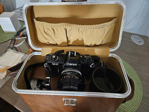 Canon EF 35mm SLR Camera Body Only with Built-In Lens Mount (5.7 in W x 3.8 in H x 1.9 in D)