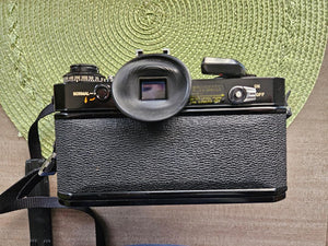 Canon EF 35mm SLR Camera Body Only with Built-In Lens Mount (5.7 in W x 3.8 in H x 1.9 in D)