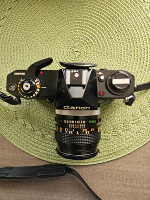 Canon EF 35mm SLR Camera Body Only with Built-In Lens Mount (5.7 in W x 3.8 in H x 1.9 in D)