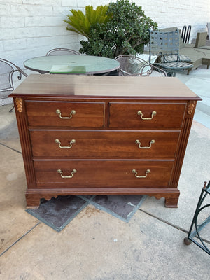 Four drawer dresser with gold hardware measuring 44, x 33 by 20