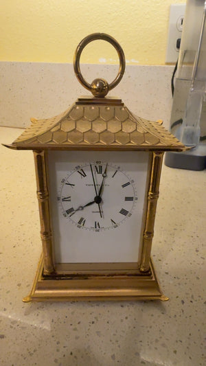 This is a Tiffany Brass carriage clock pagoda style needing replacement movement battery operated measuring approximately 6” x 4” x 3”