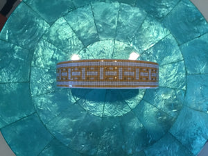 Hermès Mosaique au 24 Gold Ceramic Champagne/Wine Bottle Coaster with Central “H” Medallion (5 in Diameter)