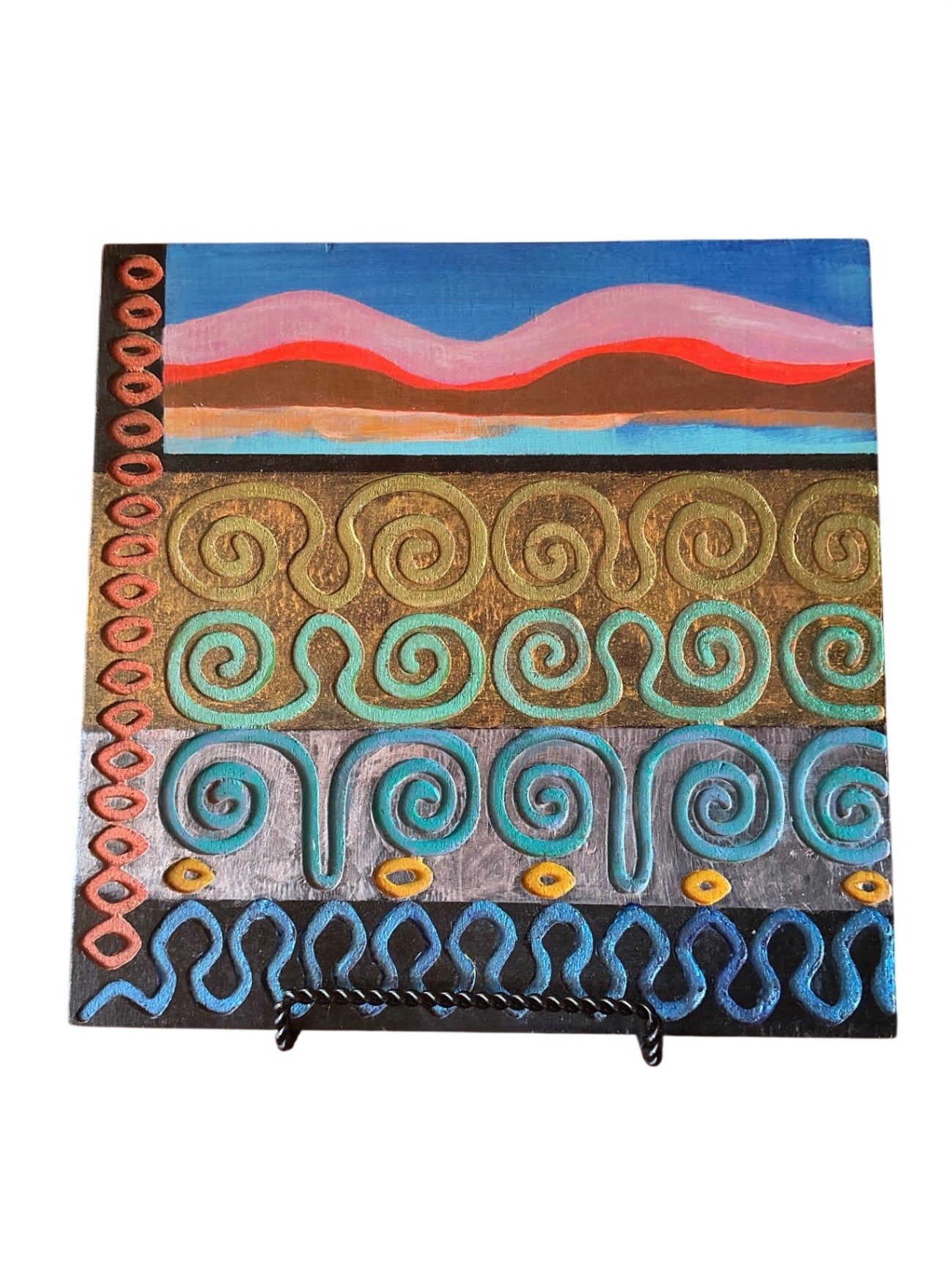 Painted Abstract Wooden Panel Wall Art with Raised Spiral & Wave Motifs on Small Black Metal Easel