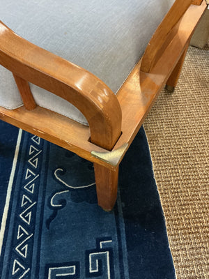 Pair of Ming style wood armchairs featuring sculptural horseshoe backs with brass detailing