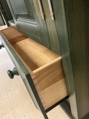 Green stained wood 2 door cabinet with drawer
