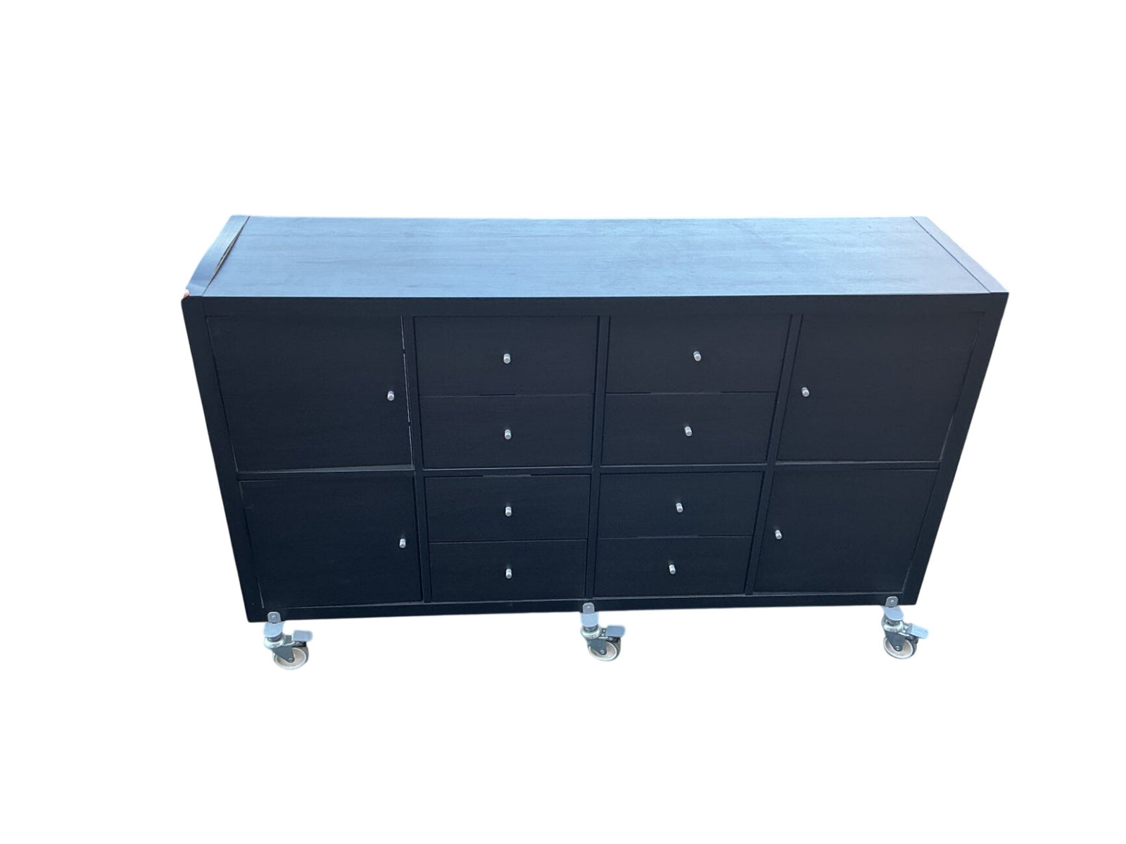 This is a eight drawer and four cubby storage unit with six wheels measuring 58 x 16 x 35
