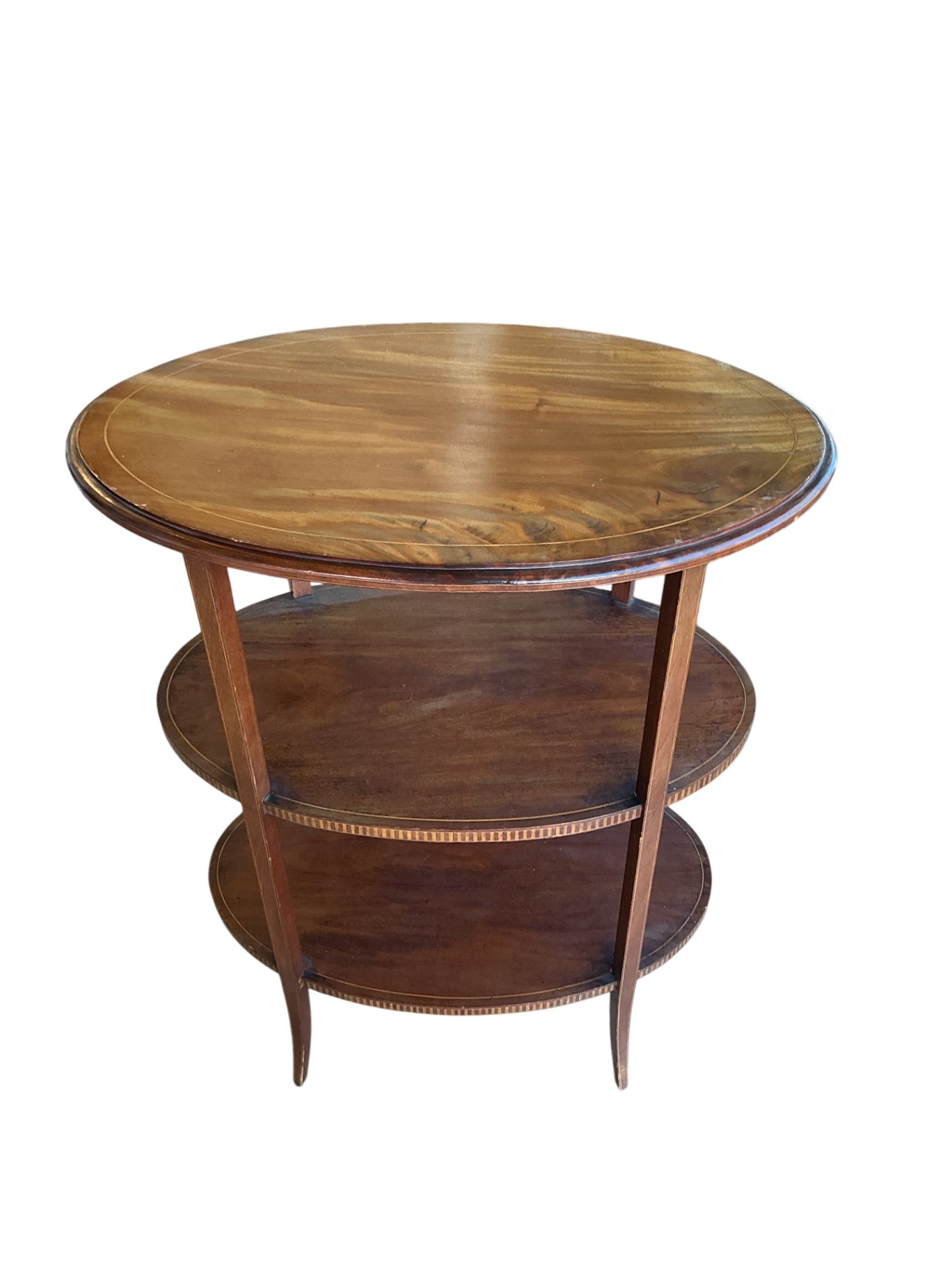Nice oval tiered table wood measuring approximately 24 inches wide by 30 inches tall