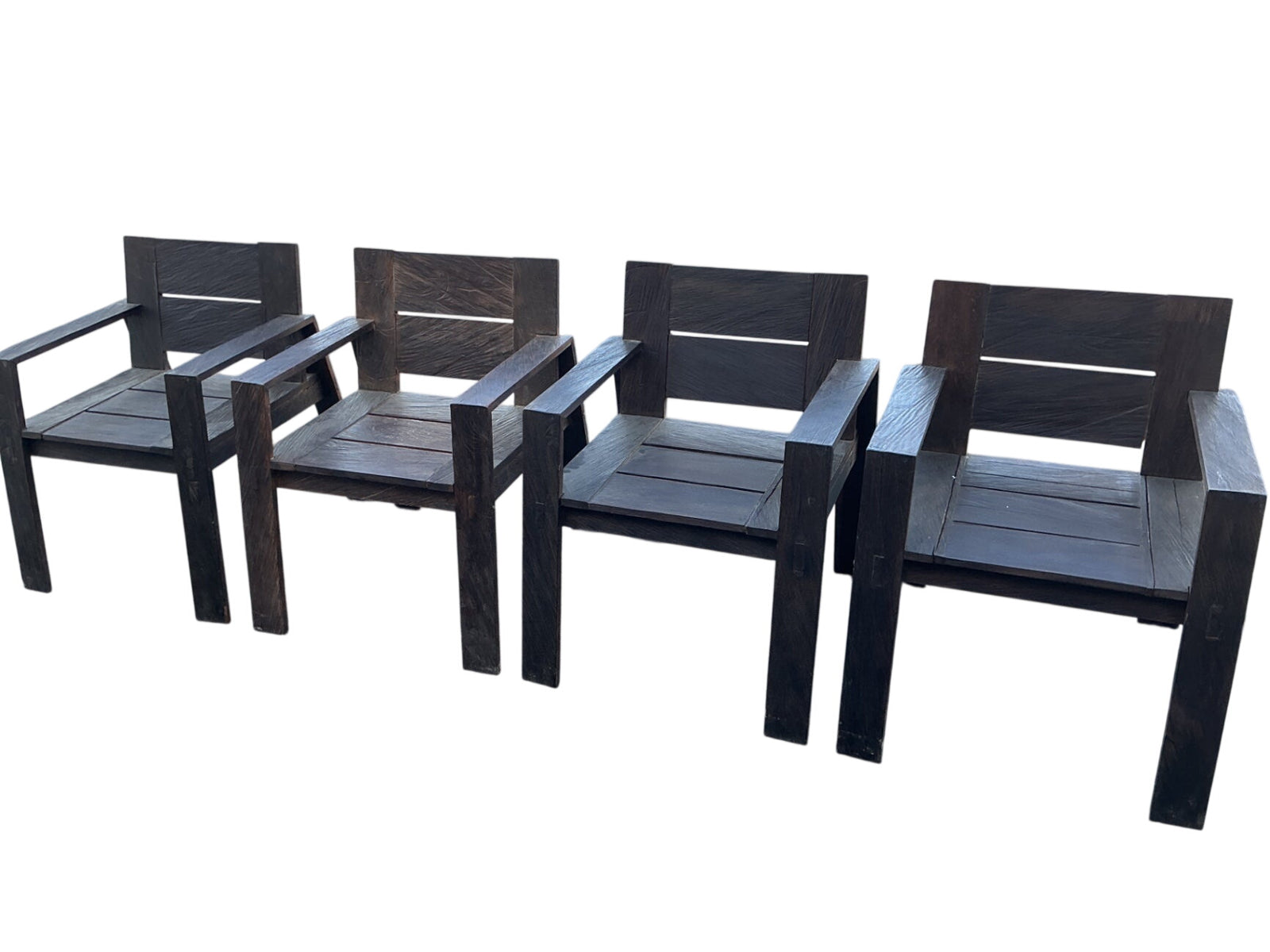 This is a set of four possibly teak, heavy chairs Appears to be custom-made