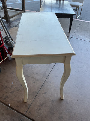 This is a white writing desk measuring 46 inches wide 30 inches tall 22 inches deep
