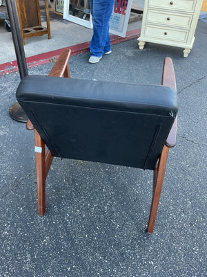 Mid-century style vinyl and wood armchair