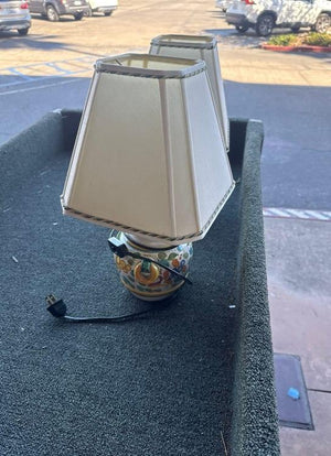 Pair of Italian Majolica Pottery Boudoir Lamps with Floral Motifs and Off-White Fabric Shades