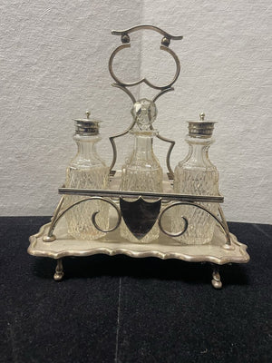 Antique Four Piece Cut Glass Condiment Set On Silver Plated Caddy