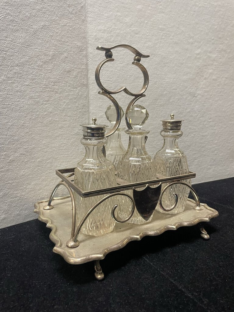 Antique Four Piece Cut Glass Condiment Set On Silver Plated Caddy