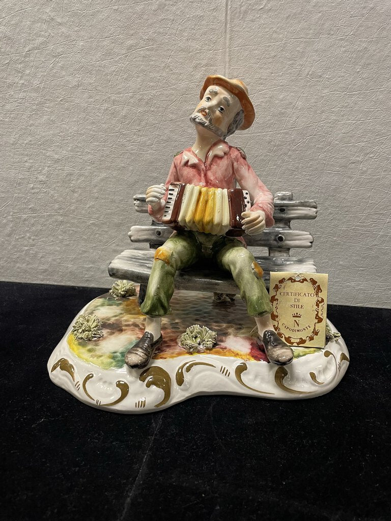 Italian Capodimonte Porcelain Man On Bench Playing Accordion 9"