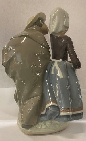 Lladro "Little Couple Kissing" 1180 (boy's neck repaired)