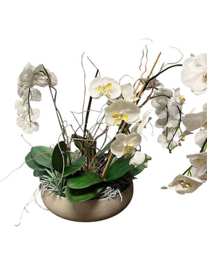 Faux White Cymbidium Orchid In Gray Pot by Miss Daisy's Consignment & Auction House