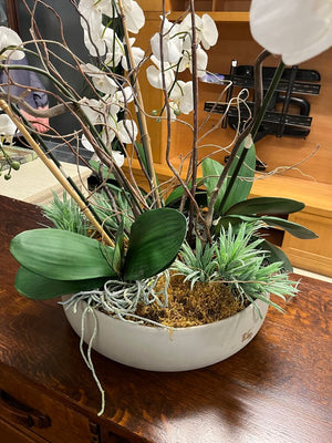 Faux White Cymbidium Orchid In Gray Pot by Miss Daisy's Consignment & Auction House